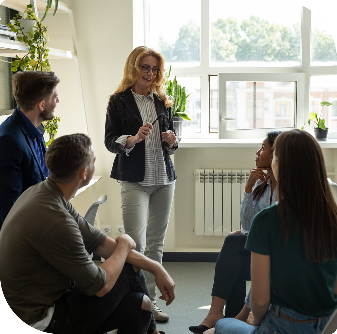 Team meeting with woman presenting